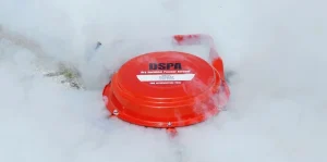 Specialized engineer inspecting a suppression agent canister during routine maintenance