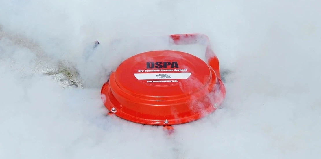 Specialized engineer inspecting a suppression agent canister during routine maintenance