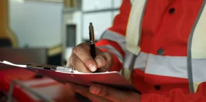 Civil Defense inspector conducting a site review of a fire alarm system installation