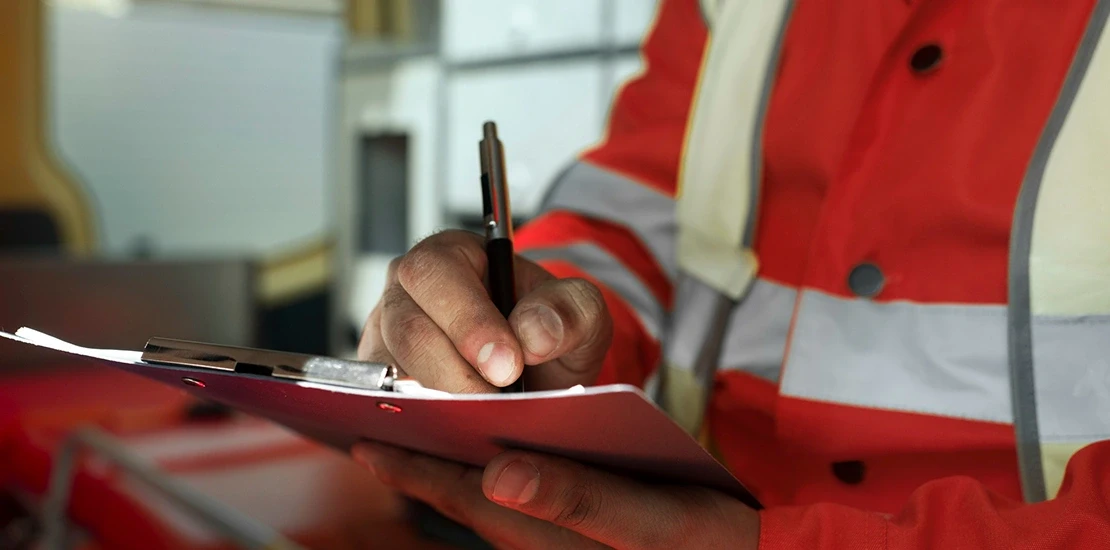 Civil Defense inspector conducting a site review of a fire alarm system installation