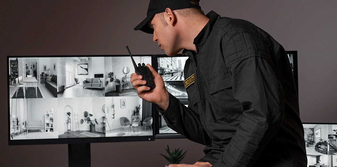 Technician checking NVR storage capacity and hard drive integrity during maintenance